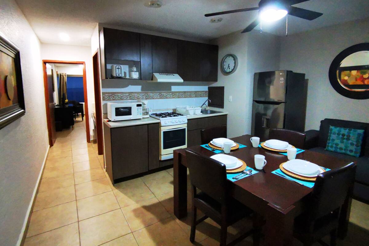 Deluxe Apartment, 2 Double Beds, Partial Sea View | Private kitchen | Fridge, microwave, oven, cookware/dishes/utensils