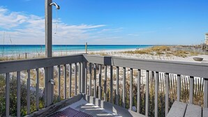 A wooden deck with a view of the beach and ocean. - Endless Summer - Home in Prestigious Community with Gulf Views & Secluded Pool Area (Miramar Beach)