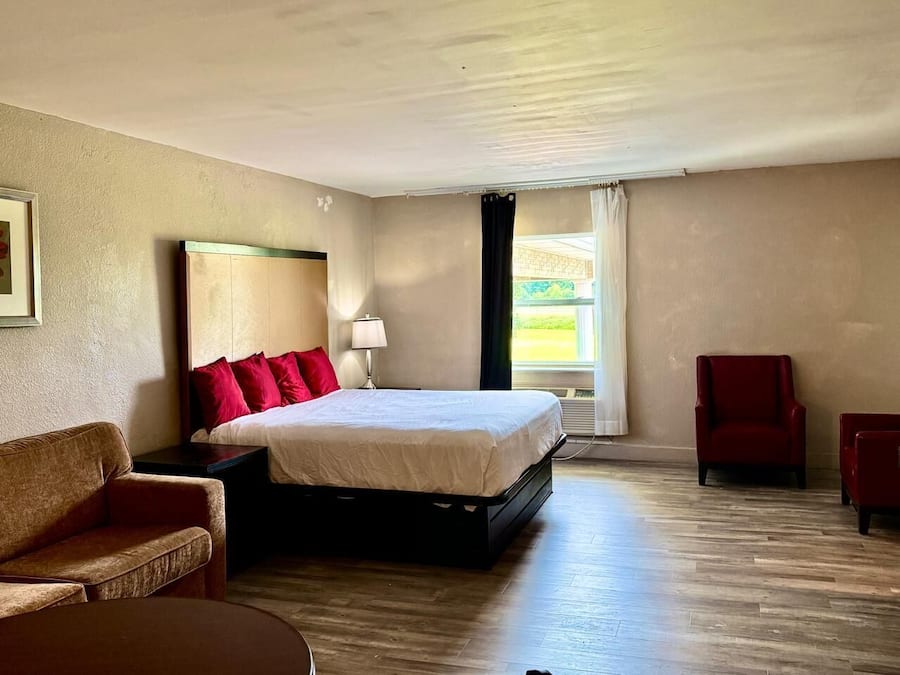Suite, 1 King Bed with Sofa bed, Non Smoking | Desk, laptop workspace, blackout drapes, iron/ironing board