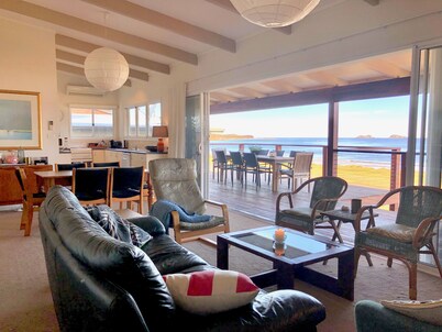 House at the beach, the sounds of waves on the breeze