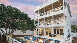 A multi-story building with a pool and outdoor seating area. - Grayton Home with Pool, Rooftop Deck & Fire Pit (Santa Rosa Beach)