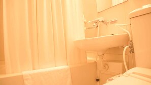 A bathroom with a sink, a mirror, and a shower area. - Business Hotel Chateau Est Takamatsu (Takamatsu)