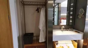 A bathroom with a white sink, a mirror, and a towel rack.