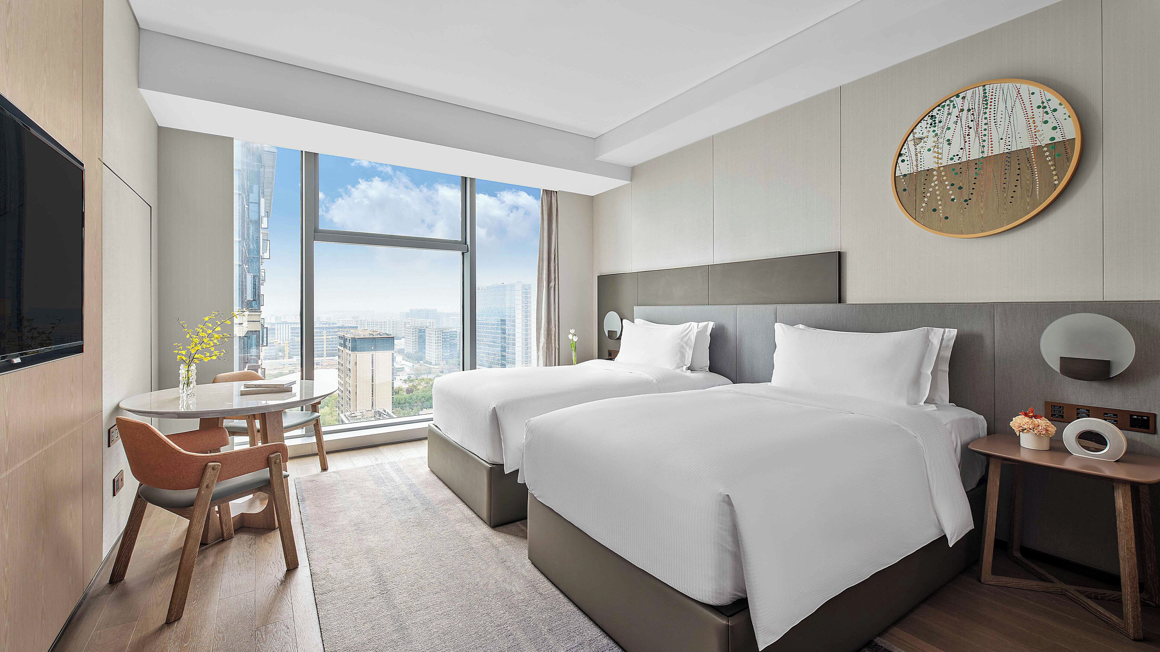 Premium bedding, down comforters, pillowtop beds, free minibar