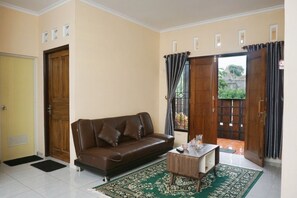 Comfort House | Living area | LED TV - Tsabit Guest House (Kalasan)