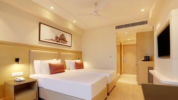 Minibar, coffres-forts dans les chambres, fer et planche à repasser