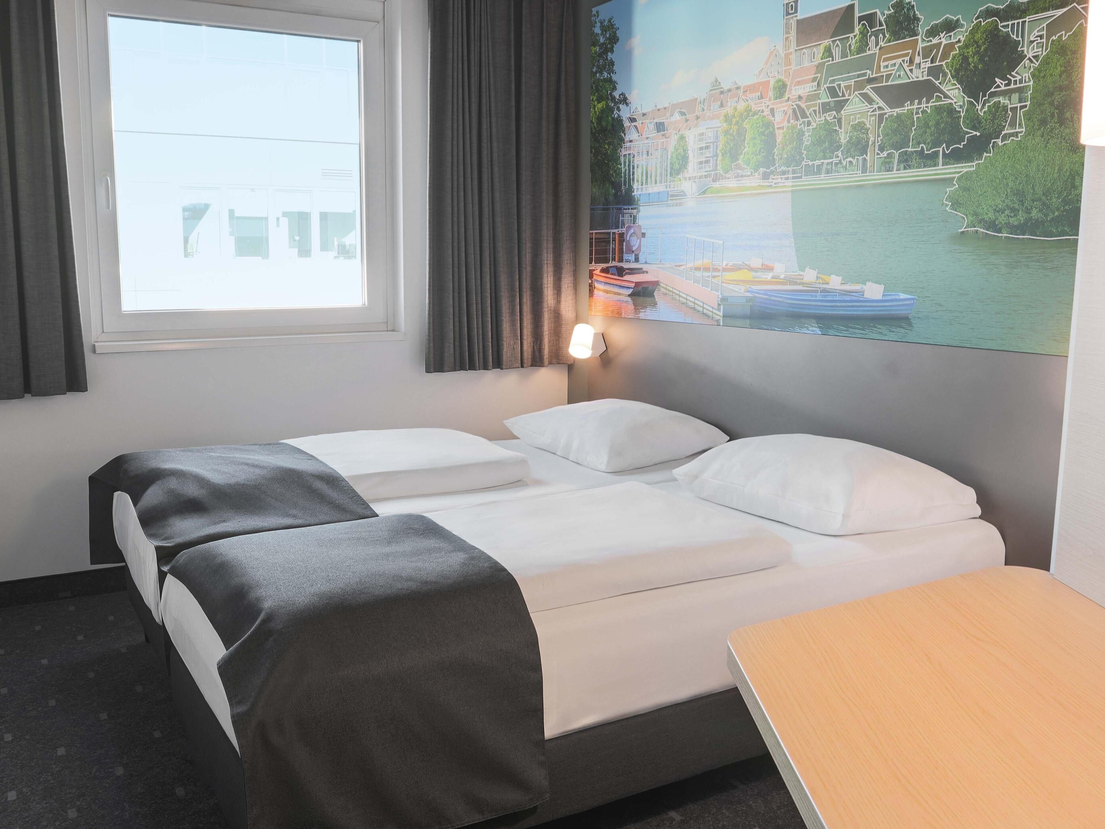 Chambre avec lits jumeaux | Literie hypoallergénique, bureau, système d’insonorisation