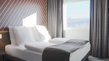 Ropa de cama hipoalergénica, escritorio y sistema de insonorización