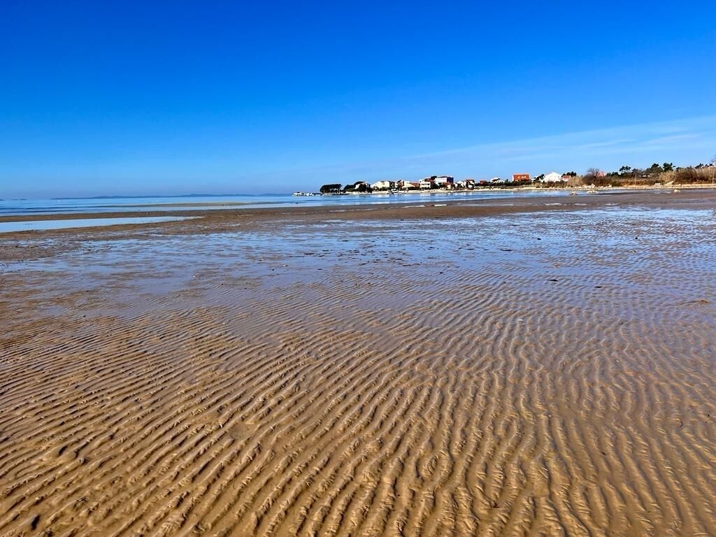 On the beach, sun-loungers, beach towels