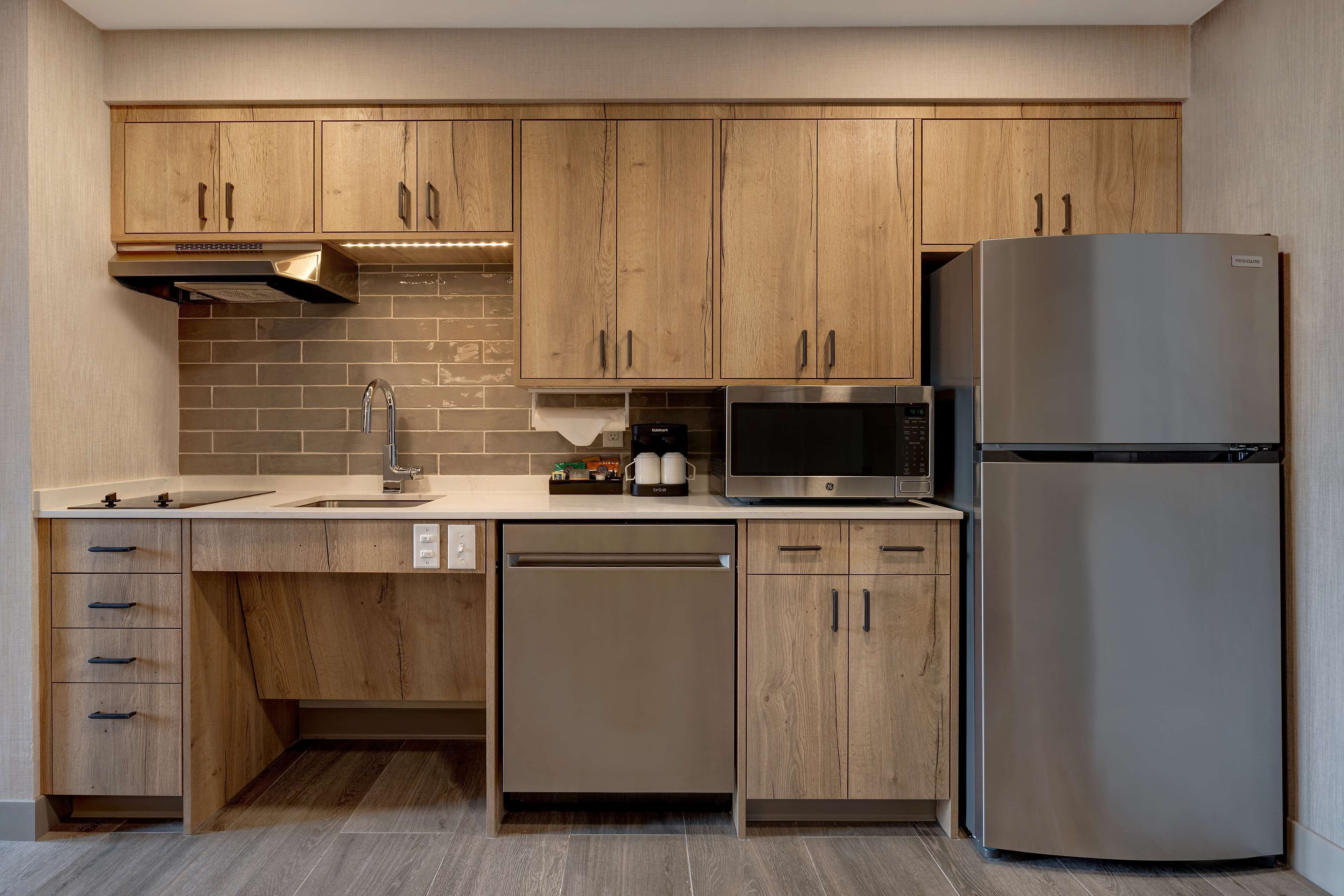 full-sized fridge, microwave, stovetop, dishwasher