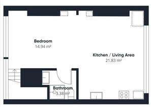 A floor plan with a bedroom (14.94 m²), kitchen/living area (21.83 m²), and bathroom (3.38 m²).