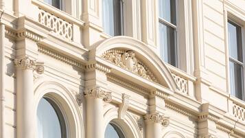 A building facade with ornate architectural details, including columns and decorative moldings.