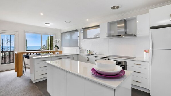 Enjoy ocean views from the kitchen window, where you can cook and dine with ease.