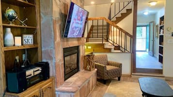 Smart TV, fireplace, DVD player, books