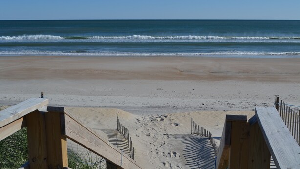 A beach with wooden walkways leading to the shore. - BACK AGAIN FOR YOUR VACATION PLEASURE!! AMAZING OCEAN & INTERCOASTAL VIEWS! (North Topsail Beach)