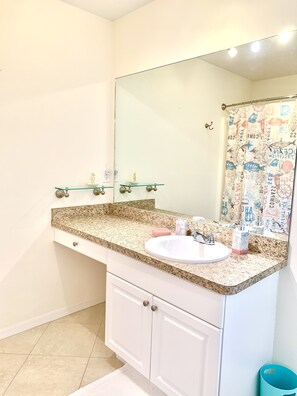 Combined shower/tub, hair dryer, towels, soap