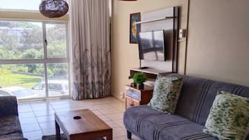 Comfort Apartment | Living area | Flat-screen TV