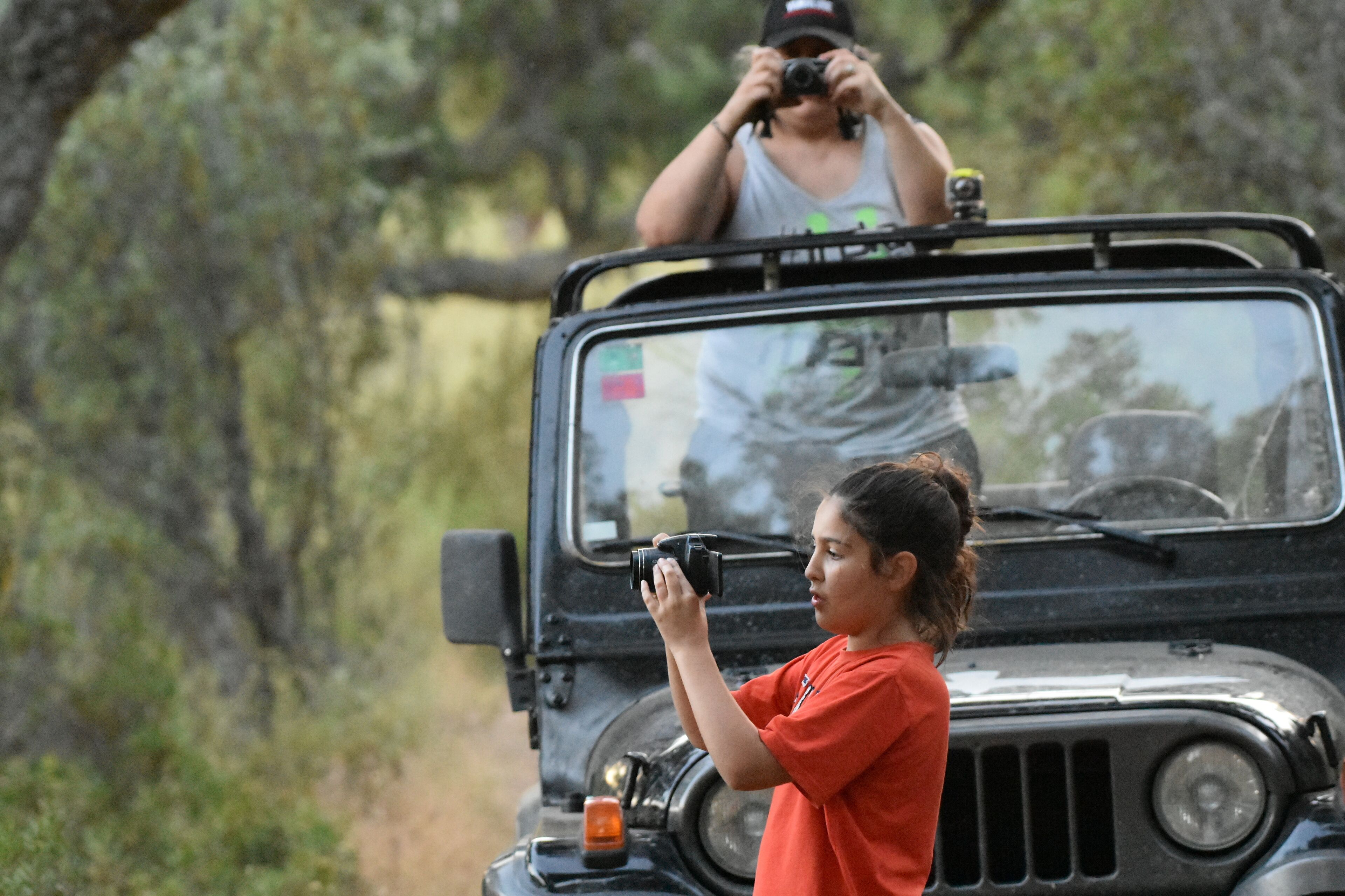 A person taking a photo with a camera.