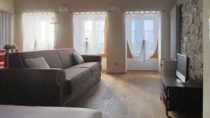 Family Studio, 1 Bedroom (Menaggio - De Benzi 17) | Living area | 32-inch TV with digital channels