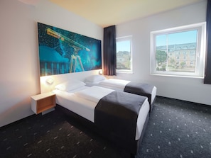 A hotel room with two beds, a large window, and a space-themed wall mural. - B&B Hotel Jena (Jena)