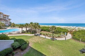 A resort with a swimming pool, beach access, and a view of the ocean. - Sandcastle Retreat - Hosted by Moore AI Rentals (Fernandina Beach)