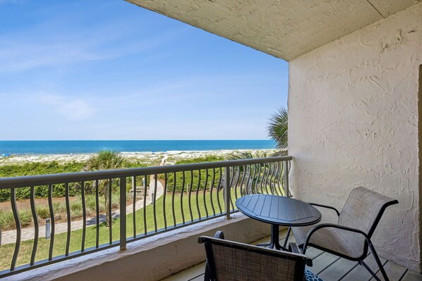 A balcony with a view of the beach and ocean. - Sandcastle Retreat - Hosted by Moore AI Rentals (Fernandina Beach)
