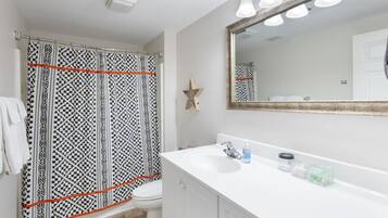 Combined shower/tub, hair dryer, towels, soap