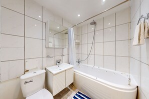 Combined shower/bathtub, hair dryer, towels, soap