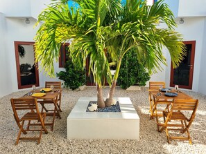 Outdoor dining - Castle Studio Sunset 🌄 with Breakfast & Kiteboarding Available (Long Bay Hills)