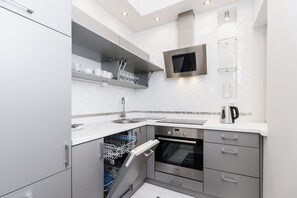 Apartment, 2 Bedrooms, Balcony | Private kitchenette | Dishwasher, electric kettle, toaster, cookware/dishes/utensils