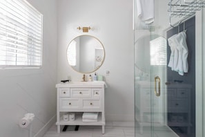 Shower, hair dryer, towels, shampoo
