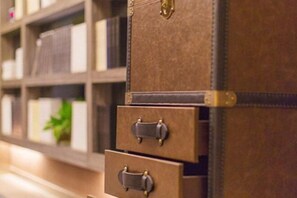 A stack of brown leather suitcases with metal clasps, arranged vertically. - Jindi Mingting Hotel (Lanzhou)