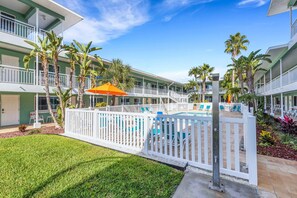 Terrace/patio - Sunny Bright Coastal Getaway – 1-BR w/ Heated Pool & Steps to Sugar Sand Beach! (Treasure Island)
