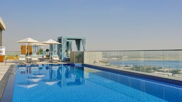 Outdoor pool, free pool cabanas, pool umbrellas
