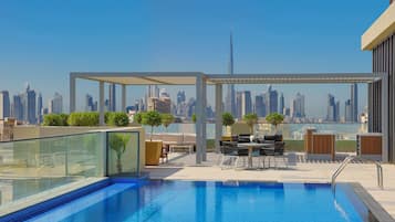 Outdoor pool, free pool cabanas, pool umbrellas