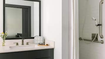 Designer toiletries, hair dryer, towels, shampoo