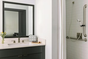 Designer toiletries, hair dryer, towels, shampoo