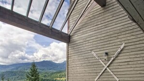 A hot tub on a balcony with a mountain view. - Luxury 3BR/2BA Creekside: Hot tub, A/C, Secure Bike Storage, Mountain Views (Whistler)