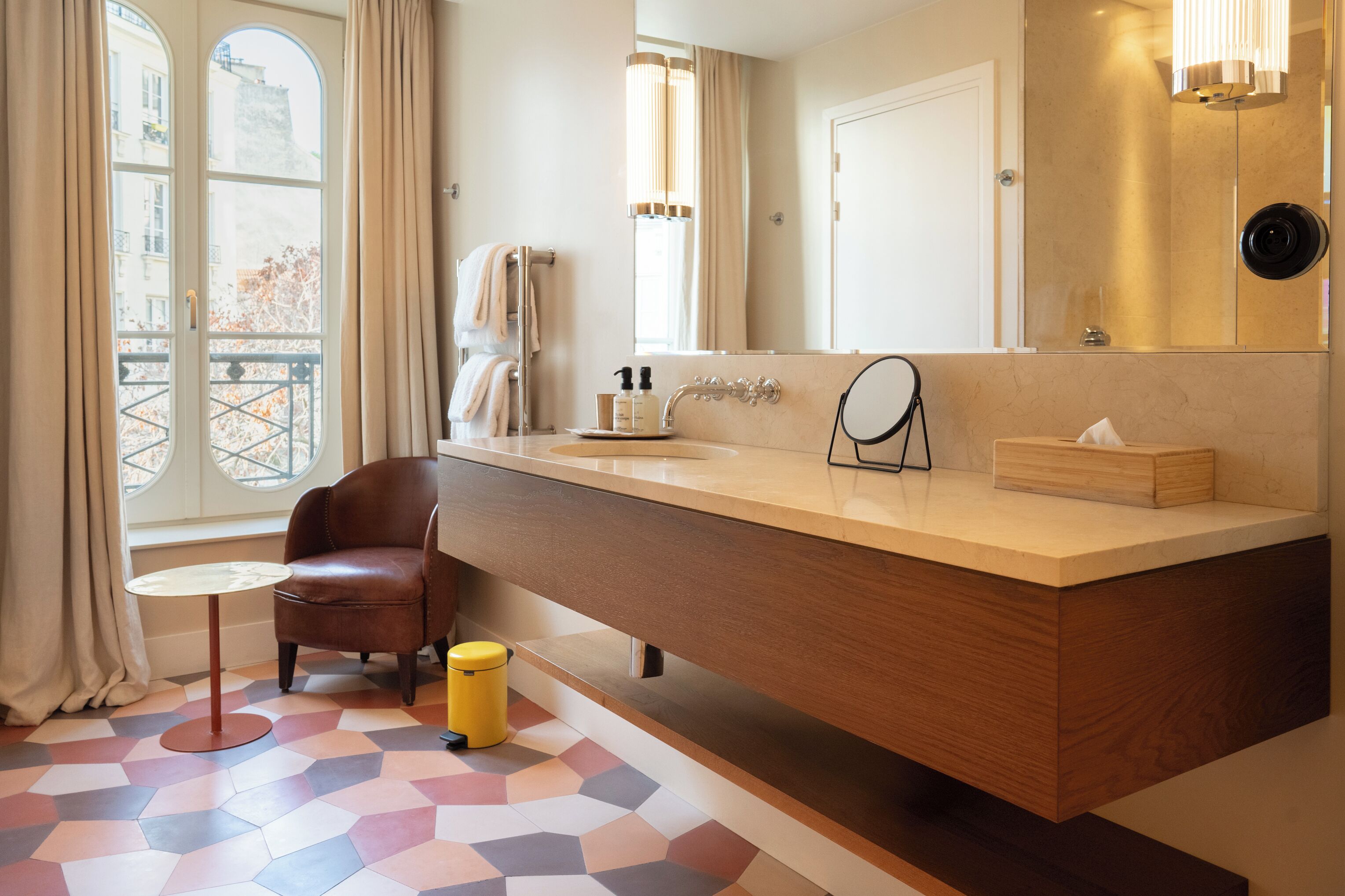 chambre double la parisienne | bathroom | designer toiletries, hair dryer, towels, soap