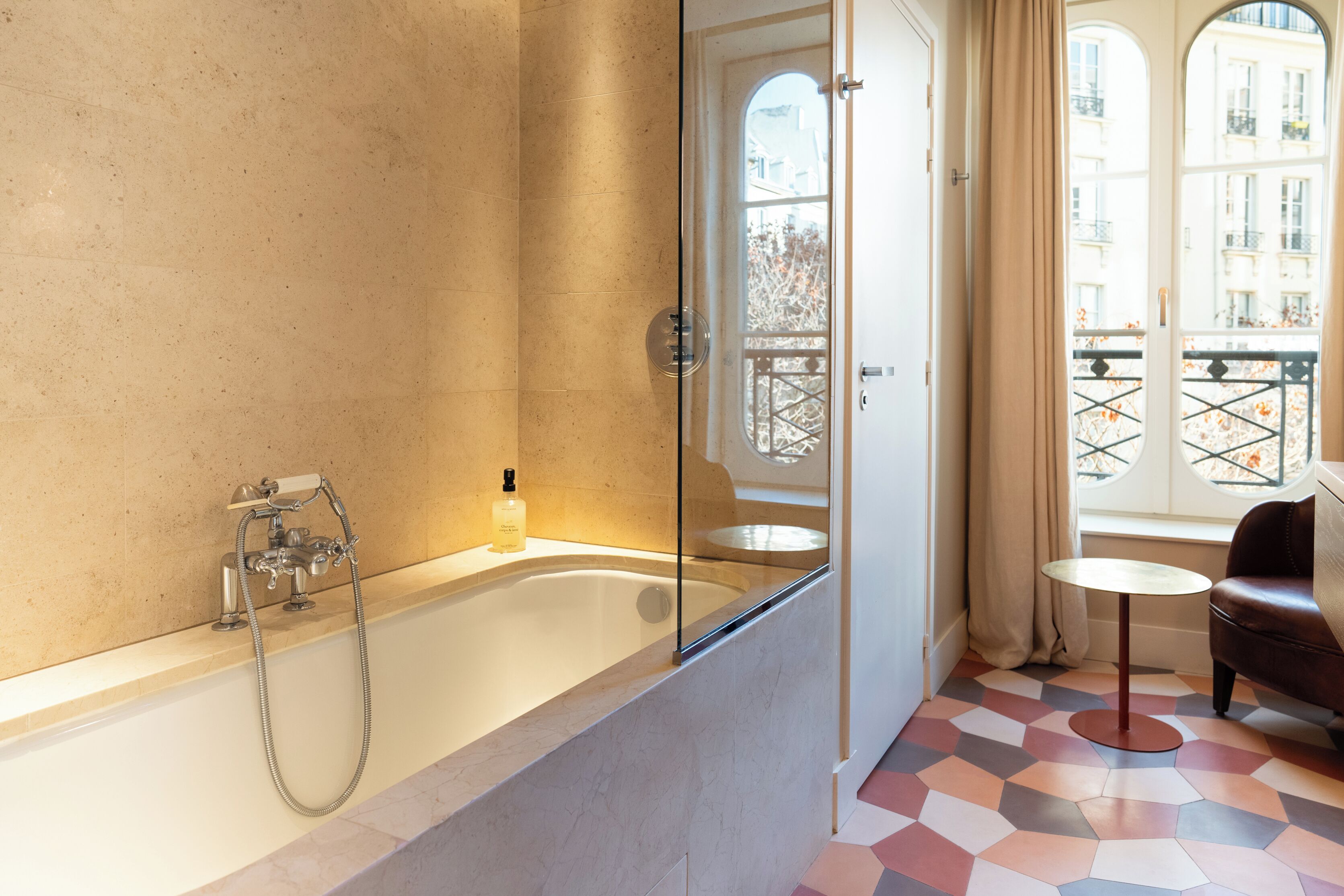 chambre double la parisienne | bathroom | designer toiletries, hair dryer, towels, soap