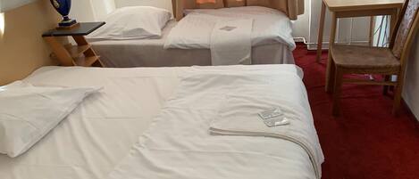 Economy Triple Room | Desk, laptop workspace, free WiFi