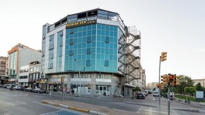 A modern building with a prominent sign for 'Hoodah Sea Lounge & Cafe'. - Grand Abimo Hotel (Istanbul)