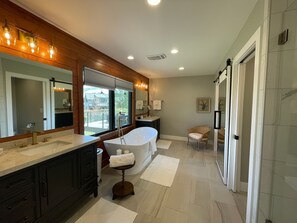 Bathtub, hair dryer, towels, soap