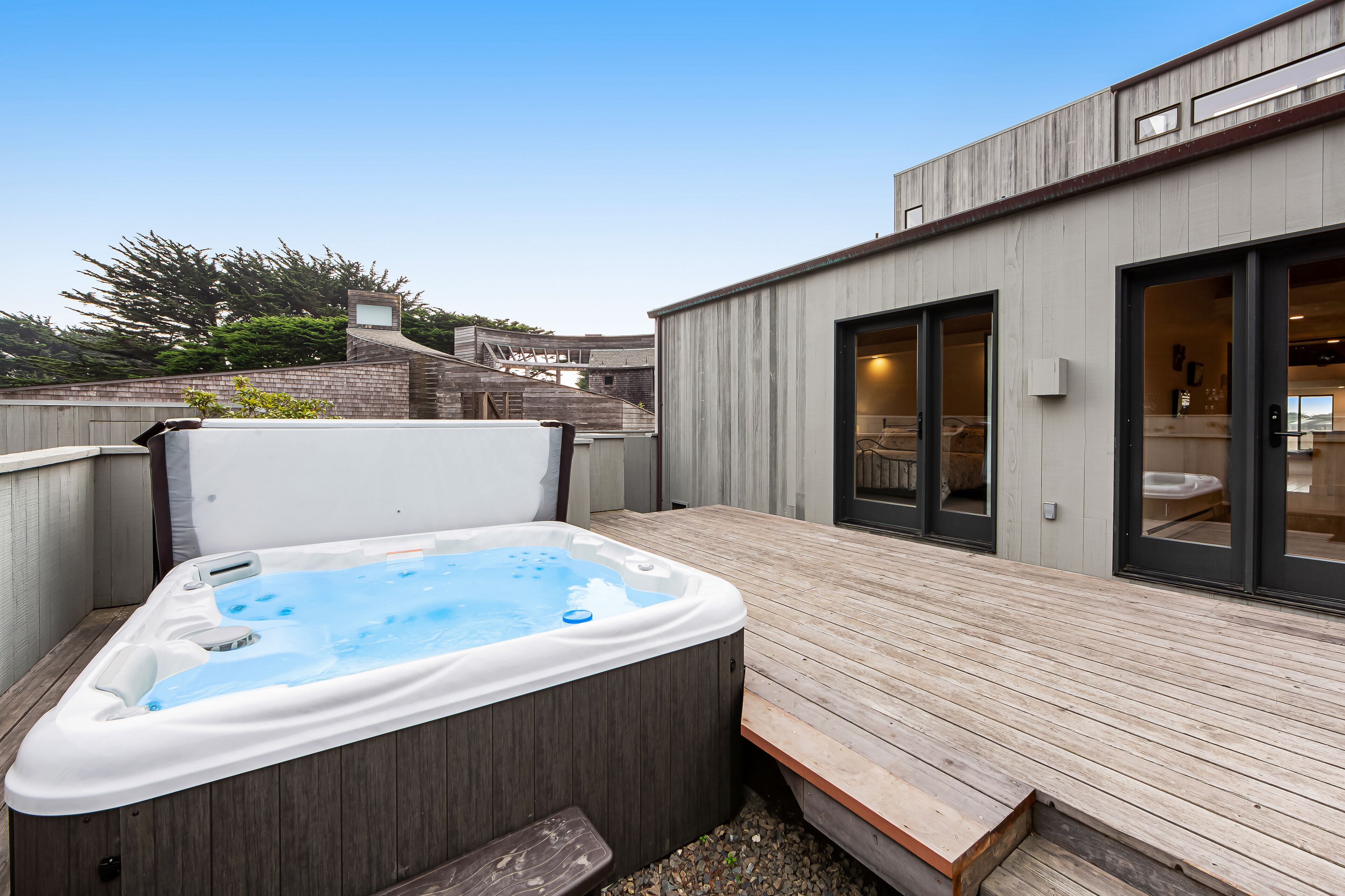 Custom-built home with a private outdoor hot tub, pool, washer/dryer, & sauna