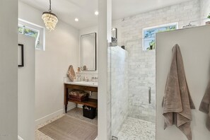 Combined shower/tub, hair dryer, towels, toilet paper