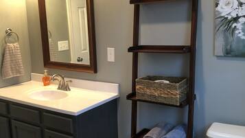 Combined shower/tub, hair dryer, towels, toilet paper