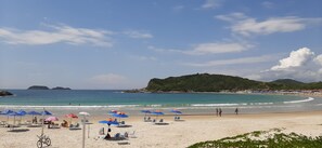 On the beach, sun-loungers