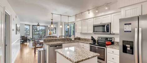 Fridge, dishwasher, coffee/tea maker, cookware/dishes/utensils