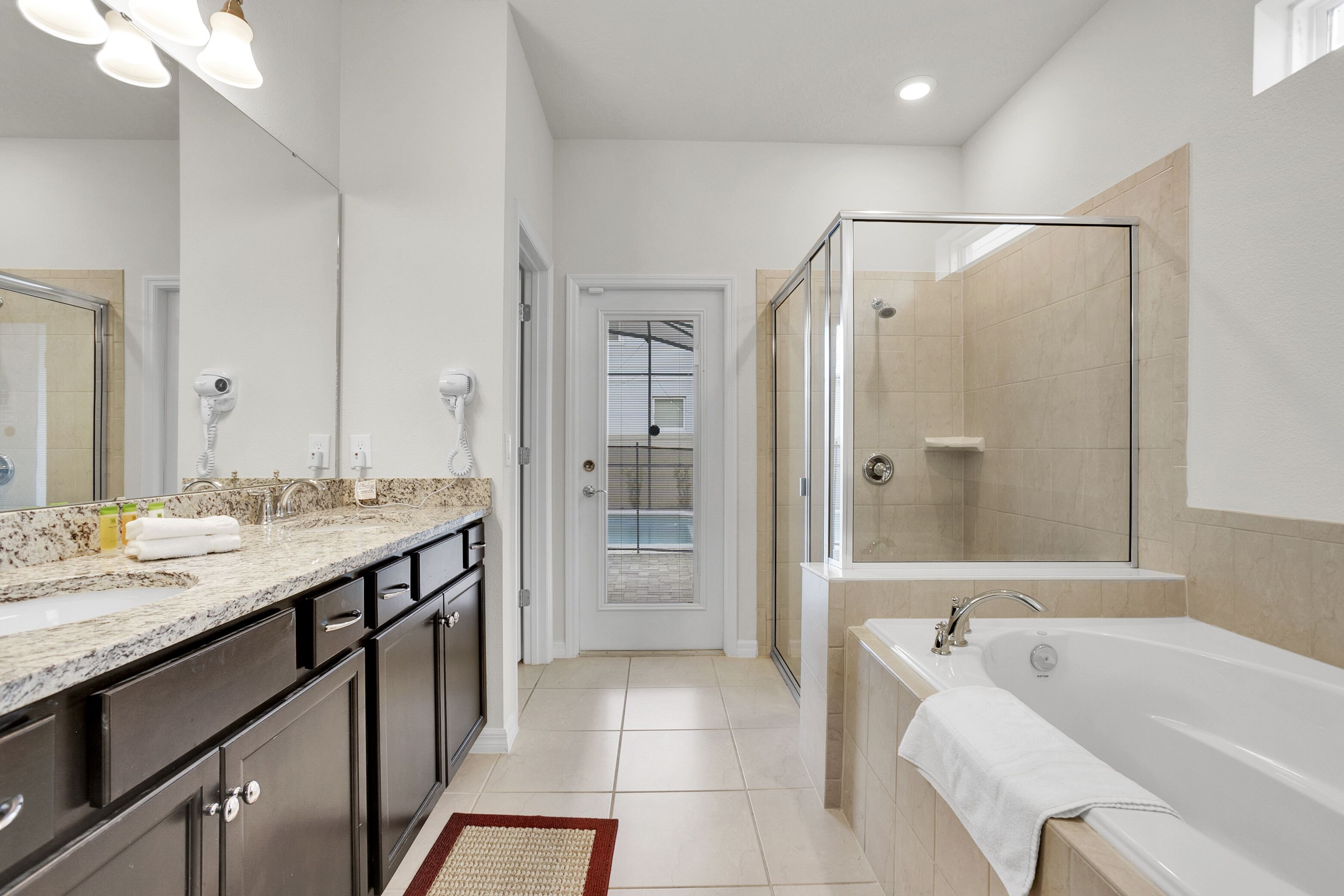 Combined shower/bathtub, hair dryer, towels, soap