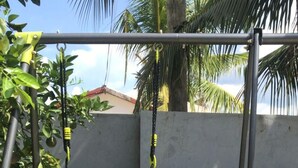 A playground with a swing set and a climbing structure. - Kumasi Atonsu Dompoase Cozy Apartment (Kumasi)